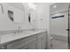 Modern bathroom with double sinks, sleek cabinetry, and a separate shower and bathtub area at 414 S Cross St, Youngsville, NC 27596