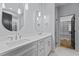 Modern bathroom features a double vanity, large mirror, and a walk-in closet at 414 S Cross St, Youngsville, NC 27596