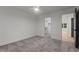 Bright bedroom with gray carpet, walk in closet, ceiling fan and a contrasting dark door frame at 414 S Cross St, Youngsville, NC 27596
