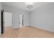 Bedroom features a large window, hardwood floors, and two doors at 414 S Cross St, Youngsville, NC 27596