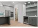 Elegant kitchen featuring stainless steel appliances, a wine cooler and custom cabinets at 414 S Cross St, Youngsville, NC 27596