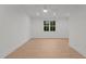 Large living room area with ceiling fan and plenty of natural light from exterior windows at 414 S Cross St, Youngsville, NC 27596