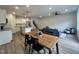 Open concept living space featuring a kitchen, dining area, and comfortable seating with natural lighting at 152 S Mistflower St, Clayton, NC 27520