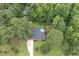 Aerial view of the home showing in-ground swimming pool and surrounding mature trees at 184 Pine E St, Lillington, NC 27546