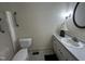This bathroom features a modern toilet, sink, vanity, and a walk in shower at 184 Pine E St, Lillington, NC 27546