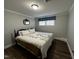 Bedroom showcasing hardwood floors, a double bed, and natural light from a window at 184 Pine E St, Lillington, NC 27546
