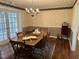 Dining room with wood table, chandelier, and hardwood floors at 184 Pine E St, Lillington, NC 27546