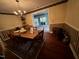 Traditional dining room featuring a wood table, chandelier and hardwood floors at 184 Pine E St, Lillington, NC 27546
