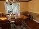 Traditional dining room featuring a wood table, chandelier, and hardwood floors at 184 Pine E St, Lillington, NC 27546