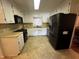 Efficient kitchen with white cabinets, modern appliances, and neutral flooring at 184 Pine E St, Lillington, NC 27546
