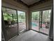 Living room area with access to the deck overlooking the pool and backyard at 184 Pine E St, Lillington, NC 27546