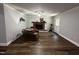 The open concept living room features hardwood floors, a brick fireplace and recessed lighting at 184 Pine E St, Lillington, NC 27546