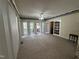 Spacious living room with plush carpet and sliding glass doors to the exterior at 184 Pine E St, Lillington, NC 27546