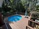 An above ground swimming pool sits on a wood deck in a backyard at 184 Pine E St, Lillington, NC 27546