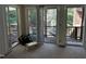 Sun room with carpet floors and sliding glass doors opening to a deck and pool at 184 Pine E St, Lillington, NC 27546