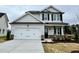 Charming two-story home featuring a spacious two-car garage and classic curb appeal at 175 W Saltgrass Ln, Smithfield, NC 27577