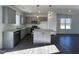 Modern kitchen with stainless steel appliances, granite countertops, and a center island at 175 W Saltgrass Ln, Smithfield, NC 27577