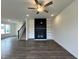 Inviting living room featuring a fireplace, built-in shelving, and open staircase at 175 W Saltgrass Ln, Smithfield, NC 27577