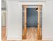 Hallway features hardwood floors and a sliding door leading to another room at 222 Kenwood Ln, Pittsboro, NC 27312