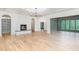 Spacious living room with fireplace, hardwood floors, coffered ceilings and large windows at 222 Kenwood Ln, Pittsboro, NC 27312
