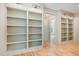 The office features hardwood floors and two built-in bookshelves with designer lighting at 222 Kenwood Ln, Pittsboro, NC 27312