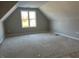 A large room with large windows and bright neutral walls at 941 Olive Branch Dr, Smithfield, NC 27577