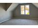 Bedroom with large window and angled ceiling at 941 Olive Branch Dr, Smithfield, NC 27577