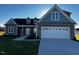 Beautiful one-story home with a two-car garage and a well-manicured front yard at 941 Olive Branch Dr, Smithfield, NC 27577