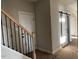 Hallway featuring a wooden staircase and a sliding door at 941 Olive Branch Dr, Smithfield, NC 27577