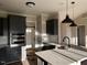 Modern kitchen featuring stainless steel appliances, granite countertops, and pendant lighting at 941 Olive Branch Dr, Smithfield, NC 27577