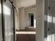 Open-concept living area with a view into the hallway and entryways at 941 Olive Branch Dr, Smithfield, NC 27577