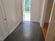 Inviting foyer with slate tile flooring leading to a bright, tree-lined front yard at 1917 New Hill Olive Chapel Rd, New Hill, NC 27562