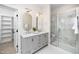 Elegant bathroom with double vanity, stone countertops, large shower with glass doors and marble at 195 N Smith St, Clayton, NC 27520
