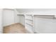 Walk-in closet offers ample storage with built-in shelving and hanging rods at 195 N Smith St, Clayton, NC 27520