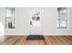 Bright foyer with wood floors, a glass door and windows on each side at 195 N Smith St, Clayton, NC 27520