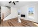 Cozy living room featuring a fireplace, and staircase at 195 N Smith St, Clayton, NC 27520