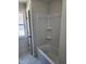 Clean bathroom showcasing a built-in tub and shower combination at 199 N Smith St, Clayton, NC 27520