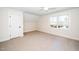 Bedroom with a large window and a door at 199 N Smith St, Clayton, NC 27520