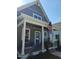 Charming gray home with an inviting front porch and rocking chairs at 199 N Smith St, Clayton, NC 27520