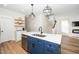 Stylish kitchen island with a stainless steel dishwasher and a sink at 199 N Smith St, Clayton, NC 27520