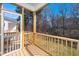 Relaxing screened porch with wood railing, offering a private outdoor space at 199 N Smith St, Clayton, NC 27520