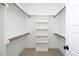 Well-organized walk-in closet with shelving and hanging rods, providing ample storage space at 199 N Smith St, Clayton, NC 27520