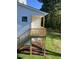 New back porch with stairs leading down to a grassy lawn at 201 N Smith St, Clayton, NC 27520