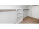 Closet space includes multiple shelves and a closet rod for hanging clothes at 201 N Smith St, Clayton, NC 27520
