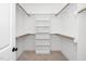 Spacious walk-in closet with ample shelving and hanging rods for organized storage at 201 N Smith St, Clayton, NC 27520