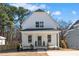 Charming two-story home with a welcoming front porch and beautifully landscaped front yard at 201 N Smith St, Clayton, NC 27520
