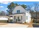 Charming two-story home with white siding, front porch, and well-manicured lawn at 201 N Smith St, Clayton, NC 27520