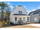 Charming two-story home with covered front porch and manicured landscaping at 201 N Smith St, Clayton, NC 27520