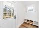 Functional mudroom entry featuring built-in bench, storage, and a stylish exterior door at 201 N Smith St, Clayton, NC 27520