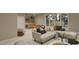 A finished basement area has a modern sectional couch, a foosball table, and a bar area at 725 Catawba St, Raleigh, NC 27609